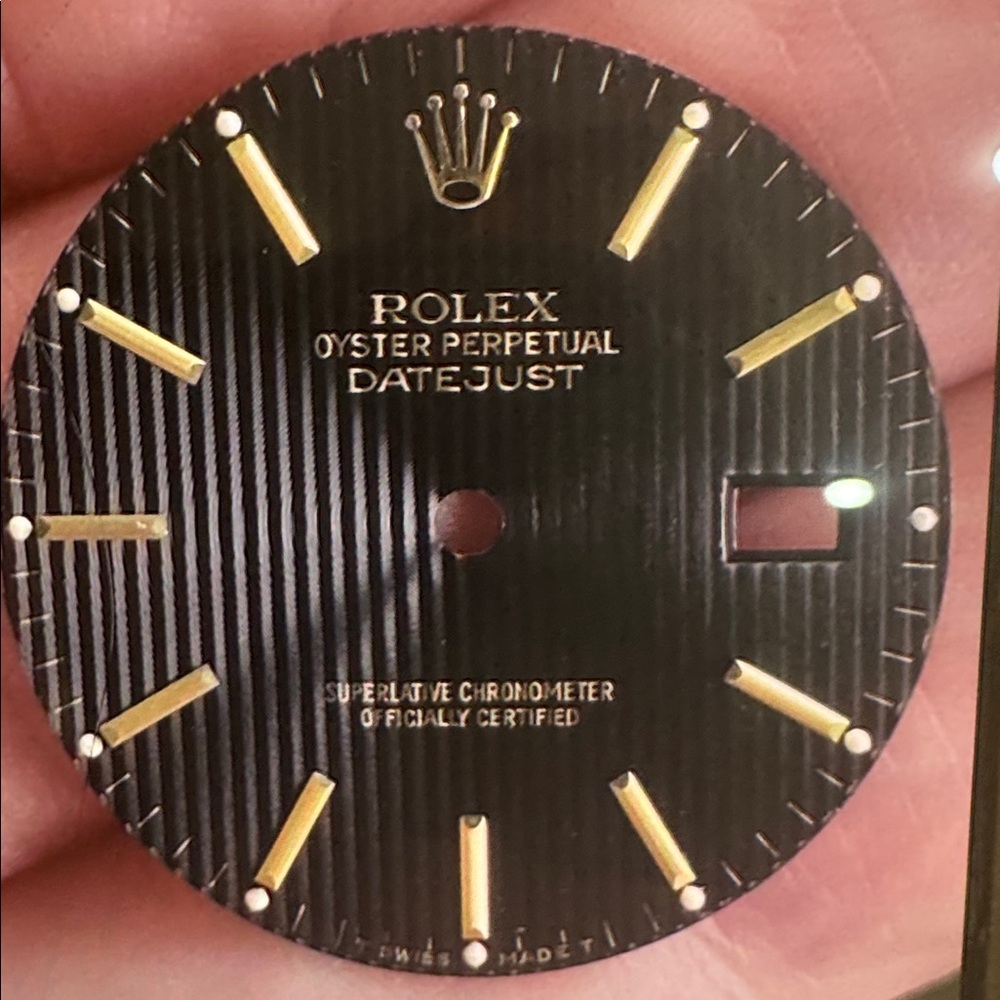 Black and Gold Rolex watch dial